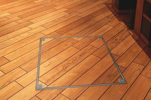 2500 Series Floor Access Cover Trim fitted into wooden flooring