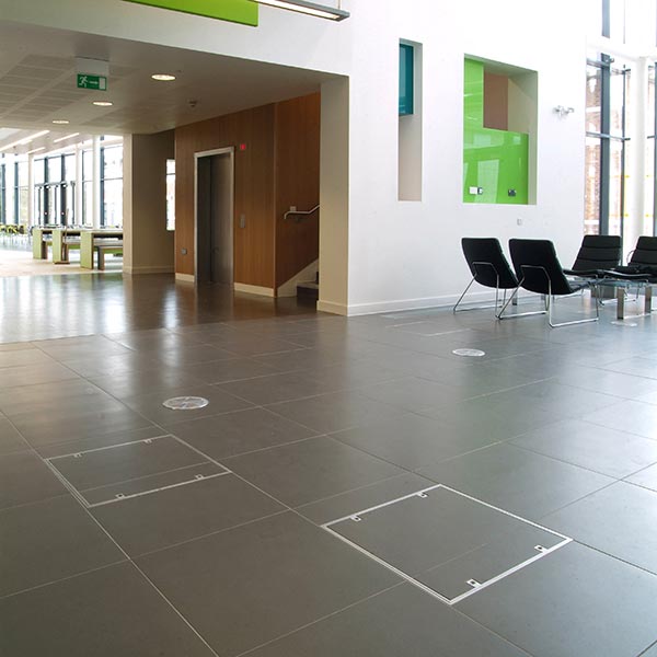 7500 series Howe Green aluminium floor access cover in a shopping centre